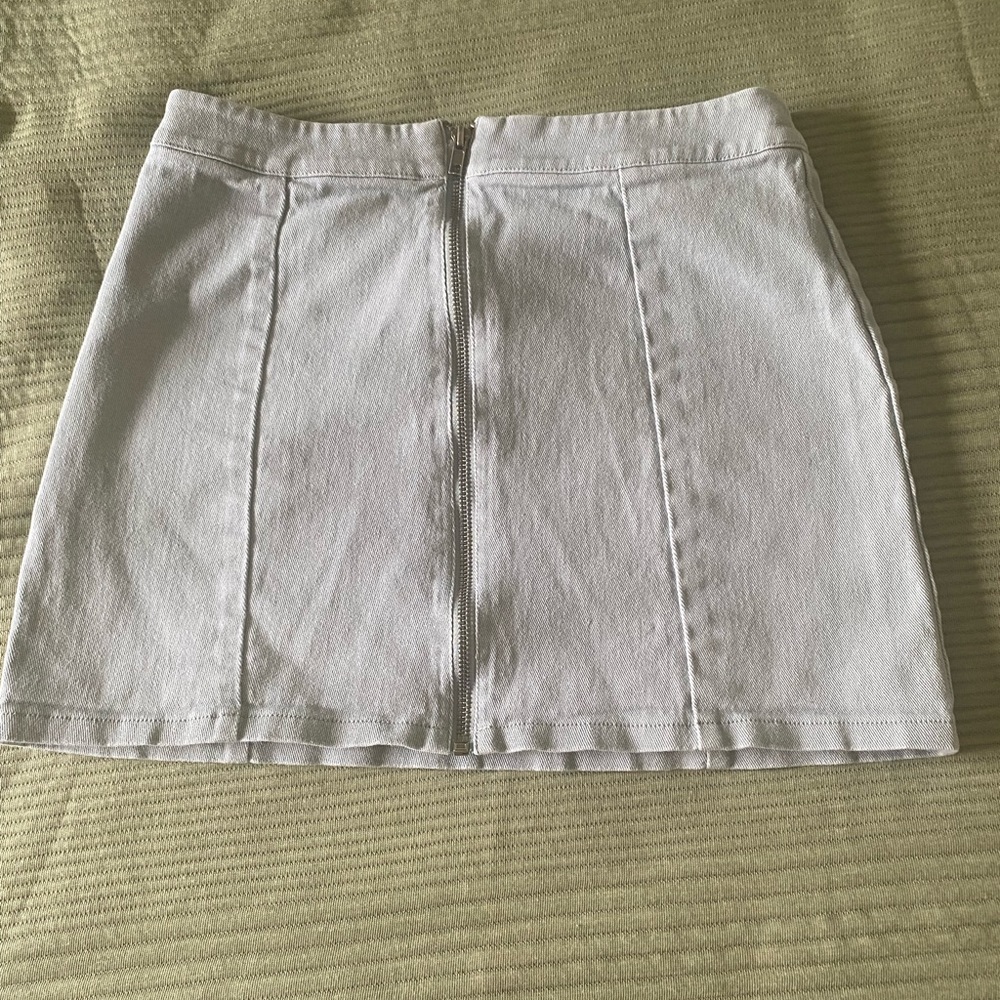 Light green mini skirt with zipper down middle
